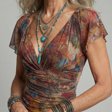 Amélia™ | Vestido midi com decote halter, bainha assimétrica e abertura lateral